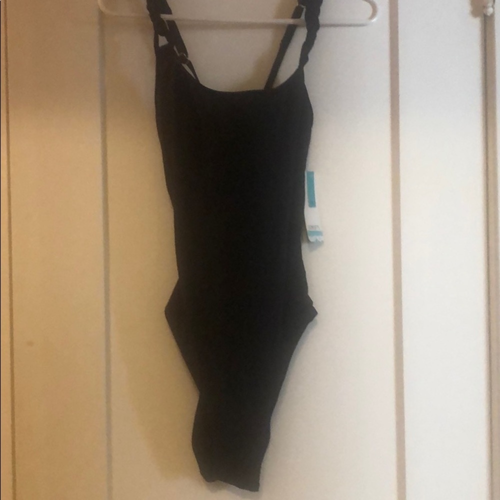 Black one piece swimsuit, with tags. Never worn.